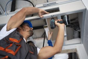 low-angle-people-working-with-drill low-angle-people-working-with-drill